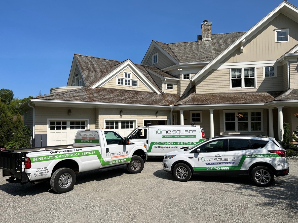 HomeSquare Pro branded trucks and van parked at a residential project